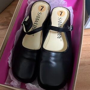 Sam and Libby slip on Mary Jane’s